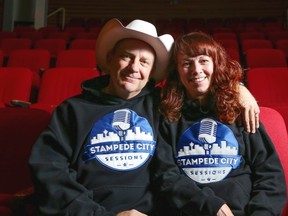 Lorne Webber, left, sits in the theatre with his wife and business partner Candace, where their musical Stampede City Sessions show takes place, at Webber Academy in Calgary, on November 6, 2014.