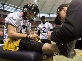 Hamilton Tiger-Cats wide receiver Luke Tasker has his shoe taped during a practice Wednesday November 26, 2014 in Vancouver. The Tiger Cats will face the Calgary Stampeders Sunday in the 102nd CFL Grey Cup.