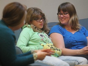 Twelve year old Jessica Anton jokes with her mom Shelley Anton and counsellor and art therapist Amy Angheluta, left,  at Hospice Calgary's Sage Centre Friday November 21, 2014.