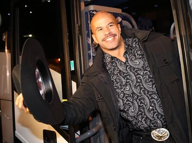 Jon Cornish boards the bus in the parking lot of McMahon Stadium Tuesday night as theCalgary Stampeders  head to the airport for Vancouver to play in Sunday's Grey Cup against Hamilton.