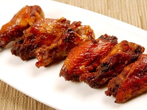 Addictive Molasses Glazed Chicken Wings are a tasty finger food for watching the Grey Cup. Credit, ATCO Blue Flame