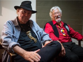 Canadian singer-songwriter Neil Young, left, and environmentalist David Suzuki sit for a photograph on November 9, 2014.