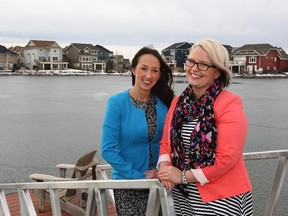 Brittney James, left, and Jessie Seymour look out over Auburn Bay from the peninsula at Auburn Sound Pointe.