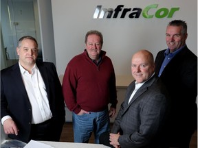 InfraCor executives Dave Stusek, manager of land development, left, Doug Clark, director of operations, Dwayne Johnston, president and CEO, and Nigel Sparling, senior project manager at the engineering firm's office on Nov. 17, 2014.