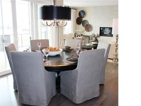 An open-concept dining area takes centre stage in the Davinci II show home by Baywest Homes in Cranston’s estate area of Riverstone. Andrea Cox for the Calgary Herald.