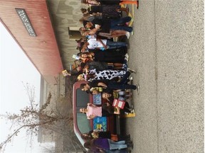Photo courtesy We Day 
 Students from St. Gregory School in Calgary hold a food drive on We Scare Hunger Day, October 30. The school is one of 135 Calgary-area schools that will be sending students to We Day Alberta, November 3 at the Saddledome in Calgary.