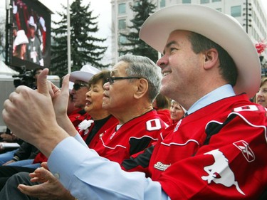 Then-mayor Dave Bronconnier and Lt.-Governor Norman Kwong join in the celebration of the Stampeders' 2008 Grey Cup win.
