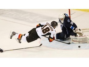 Saskatoon Blades defender Schael Higson trips up Calgary Hitmen forward Jake Virtanen on his attempt to beat Blades goalie Trevor Martin on Tuesday night in Toon town. The Hitmen won 4-1 to snap a four-game losing streak.