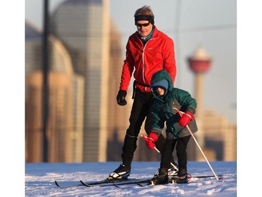 Ken Hill, 67, and his great grandson Emory Hill, 6, took advantage of the milder weather to hit the cross country ski trail around the Shaganappi Golf Course Driving Range on November 17, 2014.