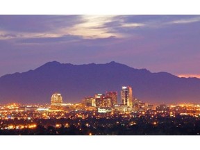 The skyline of Phoenix, Arizona, an area where many Canadians have been drawn to either as snowbirders or as permanent residents. Courtesy, Arizona Office of Tourism