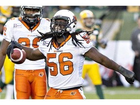 B.C. Lions Solomon Elimimian (56) celebrate the interception against the Edmonton Eskimos during first half CFL action in Edmonton on Nov. 1, 2014. Elimimian and Toronto Argonauts quarterback Ricky Ray are the finalists for the CFL's 2014  most outstanding player award.