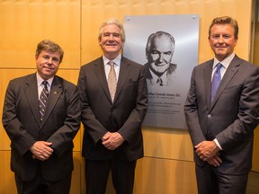 University of Calgary Dean of Law Ian Holloway, from left, joins Honourable Justice Craig Jones and Perry Spitznagel of Bennett Jones beside a new plaque honouring Maclean Jones at the University of Calgary.