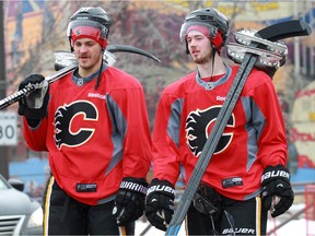 Gavin Young, Calgary Herald CALGARY, AB: NOVEMBER 19, 2014 - Calgary Flames Lance Bouma and Paul Byron walk back to the Scotiabank Saddledome after practise at the Corral on Wednesday November 19, 2014.  Gavin Young/Calgary Herald (For Sports section story by Scott Cruikshank) Trax# 00060524A