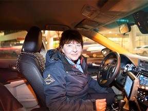 Night moves: Leah Cottam picks up a fare at the airport. If she’s lucky it will be a long trip to the southern reaches of Calgary.