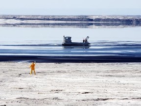 This is Syncrude’s Aurora tailings pond, where 500 ducks died in 2008 as a result of landing on the pond. A scarecrow (yellow figure) and a boat patrol were deployed to help scare away waterfowl.