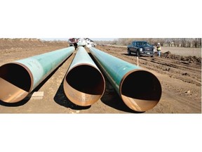Three sections of pipe sit on the ground during construction of the Gulf Coast Project pipeline in Atoka, Okla. The project is a 485-mile crude oil pipeline being constructed by TransCanada Corp.