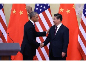President Barack Obama (L) shakes hands with Chinese President Xi Jinping (R) after a joint press conference at the Great Hall of People on November 12, 2014 in Beijing, China.  Chinese officials have outlawed the use of puns and other wordplay in newspaper headlines. Humourist Gene Weingarten has some pun with that.