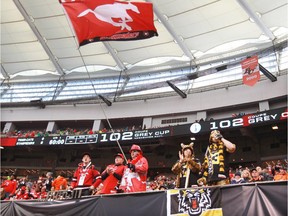 Fans watch the Stampeders and Tiger-Cats at BC Place at the 2014 Grey Cup in Vancouver on Sunday, Nov. 30, 2014.