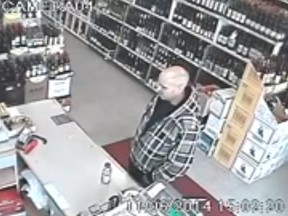 This image is from a surveillance video uploaded to YouTube. Calgary police suspect this man is involved in the thefts of at least five poppy boxes in the city.