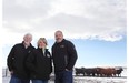 Wynne Chisholm (centre) and husband Bob (left) join University of Calgary animal behaviour and welfare professor Ed Pajor for a photo at W.A. Ranches near Madden, after Wynne and her father donated $5 million to support research at the university.
