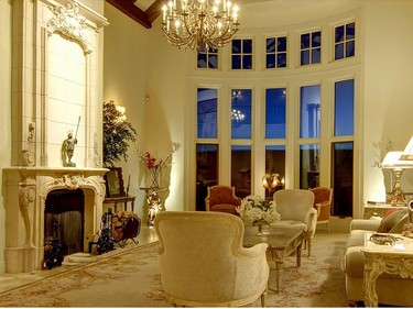The home features a collection of antiques and chandeliers.