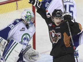 Calgary Hitmen defenceman Travis Sanheim celebrates a goal against the Swift Current Broncos last Friday. On Monday he and teammate Jake Virtanen were invited to Team Canada's World Junior selection camp.