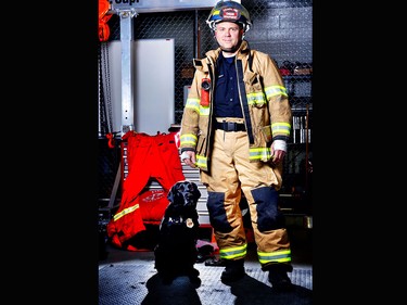 Honey, a 4-year-old black Labrador retriever is an accelerant detection canine with the Calgary Fire Department with his handler Brad McDonald, fire investigator.