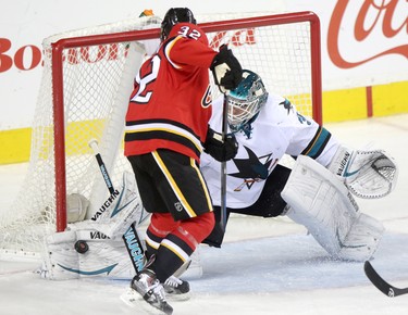 CALGARY;  DECEMBER 6, 2014  -- Calgary Flames Paul Bryon, left, tries to score on San Jose Sharks goalie Antti Niemi during their game at the Scotiabank Saddledome in Calgary on December 6, 2014.
(Leah Hennel/Calgary Herald)  
For Sports by Kristen Odland