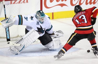 CALGARY;  DECEMBER 6, 2014  -- Calgary Flames Johnny Gaudreau, right, tries to score on  San Jose Sharks goalie Antti Niemi during their game at the Scotiabank Saddledome in Calgary on December 6, 2014.
(Leah Hennel/Calgary Herald)  
For Sports by Kristen Odland