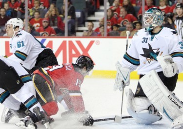 CALGARY;  DECEMBER 6, 2014  -- Calgary Flames Johnny Gaudreau, left, collides into  San Jose Sharks Antti Niemi during their game at the Scotiabank Saddledome in Calgary on December 6, 2014.
(Leah Hennel/Calgary Herald)  
For Sports by Kristen Odland