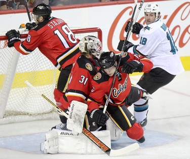 Calgary Flames collide into their net.