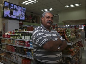 Mudhir Mohamed poses in his shop, the Jubba-Nile Supermarket on 17th Ave. S.E. in Calgary, on December 8, 2014.