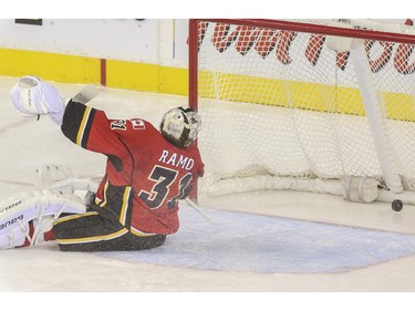 Calgary Flames goalie Karri Ramo lets another one get by during game action against the New York Rangers at the Scotiabank Saddledome in Calgary, on December 16, 2014.