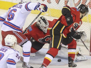 Calgary Flames goalie Karri Ramo makes a save agains the New York Rangers during first period action at the Scotiabank Saddledome in Calgary, on December 16, 2014.