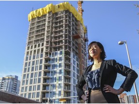 Felicia Mutheardy, senior market analyst for Canada Mortgage and Housing Corp.,near some condo construction in downtown Calgary, on December 17, 2014.