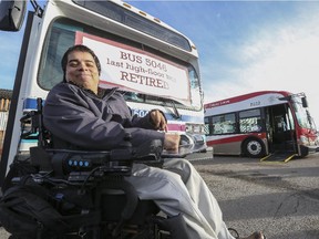 Mark Flores, member of Access Calgary Advisory Committee, visits Calgary Transit as it displays its last high-floor bus, which it is retiring today and finally making its entire bus fleet 100 per cent accessible in Calgary, on December 18, 2014. Flores says this is an exciting step towards full inclusion as Calgarians. -