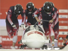 Kaillie Humphries competes with the men at the four men bob World Cup at Canada Olympic Park in Calgary, on December 20, 2014.