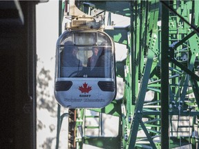 Passengers ride on the Banff sightseeing gondola, located just five minutes from the Town of Banff, on the shoulder of Sulphur Mountain, in the heart of the Canadian Rockies, on December 24, 2014.