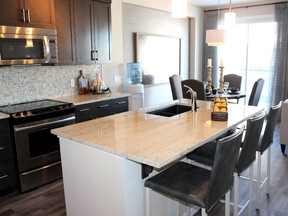The kitchen in the Pinnacle show home by Calbridge Homes in the Ravines of Sunset Ridge, Cochrane.