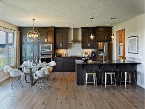 The kitchen in the Tremont show home by Trico Homes in Airdrie's Cooper's Crossing.