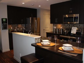 The kitchen in the Meridian show home by Innovations by Jayman in Sunset Ridge, Cochrane.