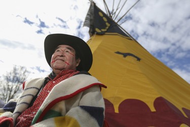 Louis Soop, Piipiakihtsipiimi, respected elder of the Kainai Nation, sits before the Yellow Otter Tipi, a traditional design that has been in his family for generations and which was set up during a traditional Tipi Transfer Ceremony, courtesy of himself and his wife Abby Soop, Matoiyohkomiaakii, at Heritage Park in Calgary, on October 3, 2014.  Ellen Gasser, Heritage Park public programming co-ordinator, and Joe Anderson, Heritage Park society vice-president, accepted the design and guardianship on behalf of the park.