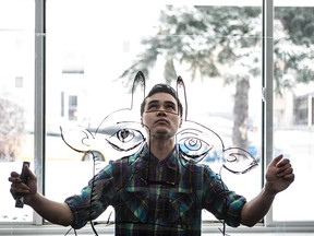 Transparent motivation: Sitter holds up a sample of his artwork done on glass.