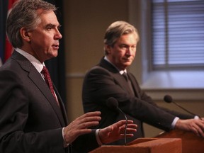 Gary Doer, right, Ambassador of Canada to the United States of America, talks with Alberta Premier Jim Prentice, in Calgary, on December 19, 2014.