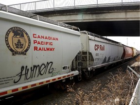 File — A Canadian Pacific Rail train passes through Calgary, Thursday, May 1, 2014.