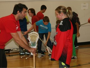 Andrew McBride, captain of the Calgary Roughnecks and a Herald Christmas Fund guest columnist, gives back to the community by taking his passion for lacrosse to the classroom.