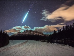 Calgary photographer Brett Abernethy captured a shot of  fireball streaking across the night sky in Banff over Mount Rundle on Saturday, December 20, 2014.
