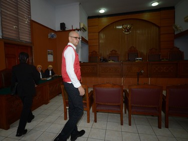 Canadian teacher Neil Bantleman enters a court room prior to his trial at the South Jakarta court in Jakarta.
