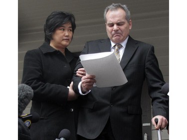 Doug de Grood, with his wife Susan de Grood at his side, reads a prepared statement expressing their grief for the families of the victims, Thursday at the office of the lawyer for their son Matthew. Matthew de Grood is the accused in the stabbing murders of five students earlier this week. They are at the office of lawyer Allan Fay.