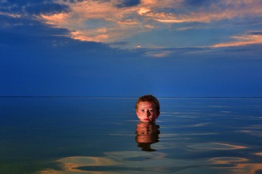My son, Hunter poses for a portrait while on vacation this summer at Buffalo lake.